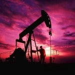 Alabama, USA. Worker Checking Oil Pump